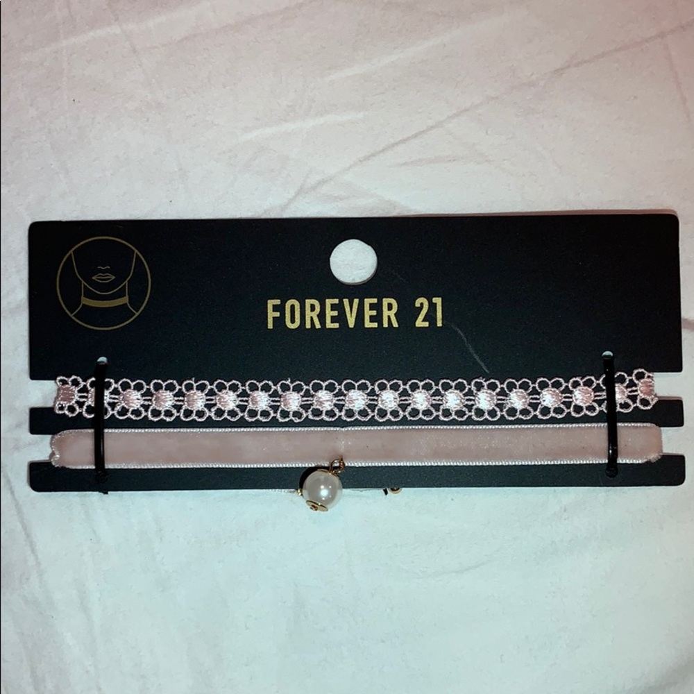 Two light pink chokers